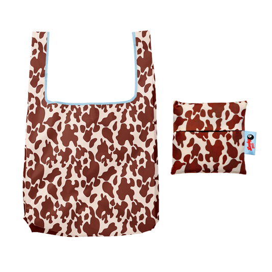 Brown and cream cow-print foldable nylon tote with light blue trim, shown open beside its matching zippered pouch - PABOOM