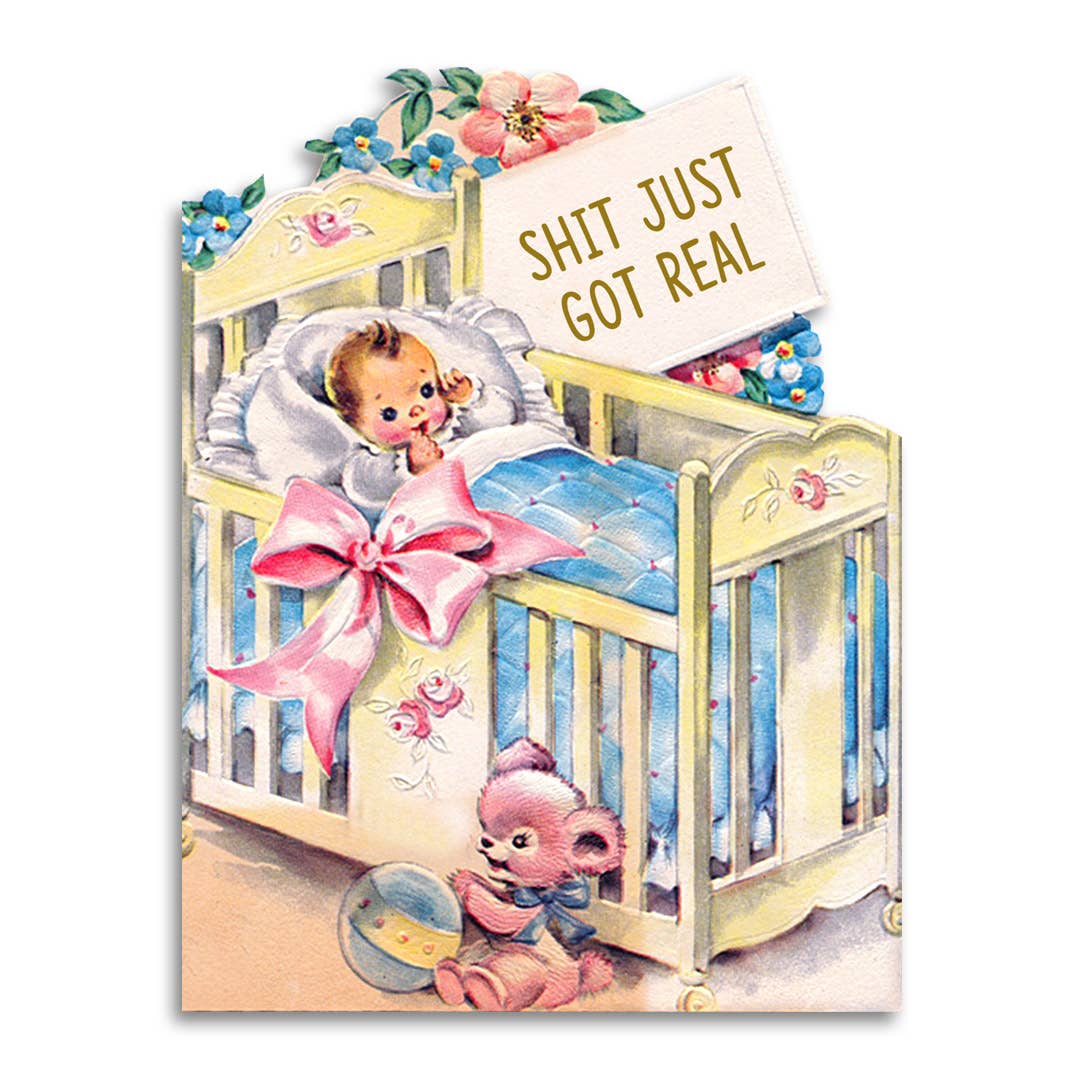 Die-cut vintage illustration of a sleeping baby in a crib with a teddy bear, reading Shit Just Got Real