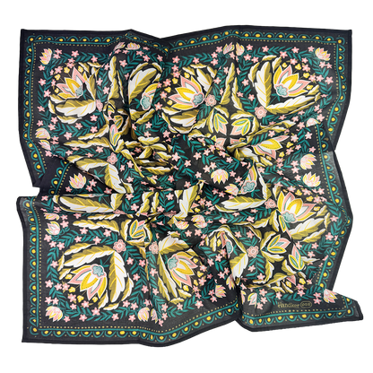 Wild Rag Betty Bandana flat lay in black with gold, pink and green floral print