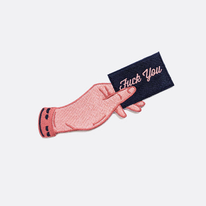 Iron-on embroidered patch of a hand holding a card that reads Fuck You - PABOOM