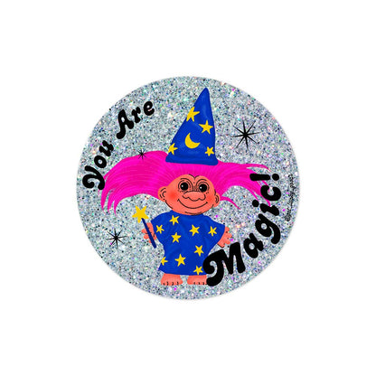 Circular holographic glitter sticker of a wizard troll with pink hair, blue starred robe and hat, holding a wand, text "You Are Magic!" - PABOOM