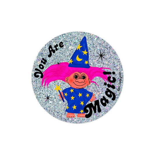 Circular holographic glitter sticker of a wizard troll with pink hair, blue starred robe and hat, holding a wand, text "You Are Magic!" - PABOOM