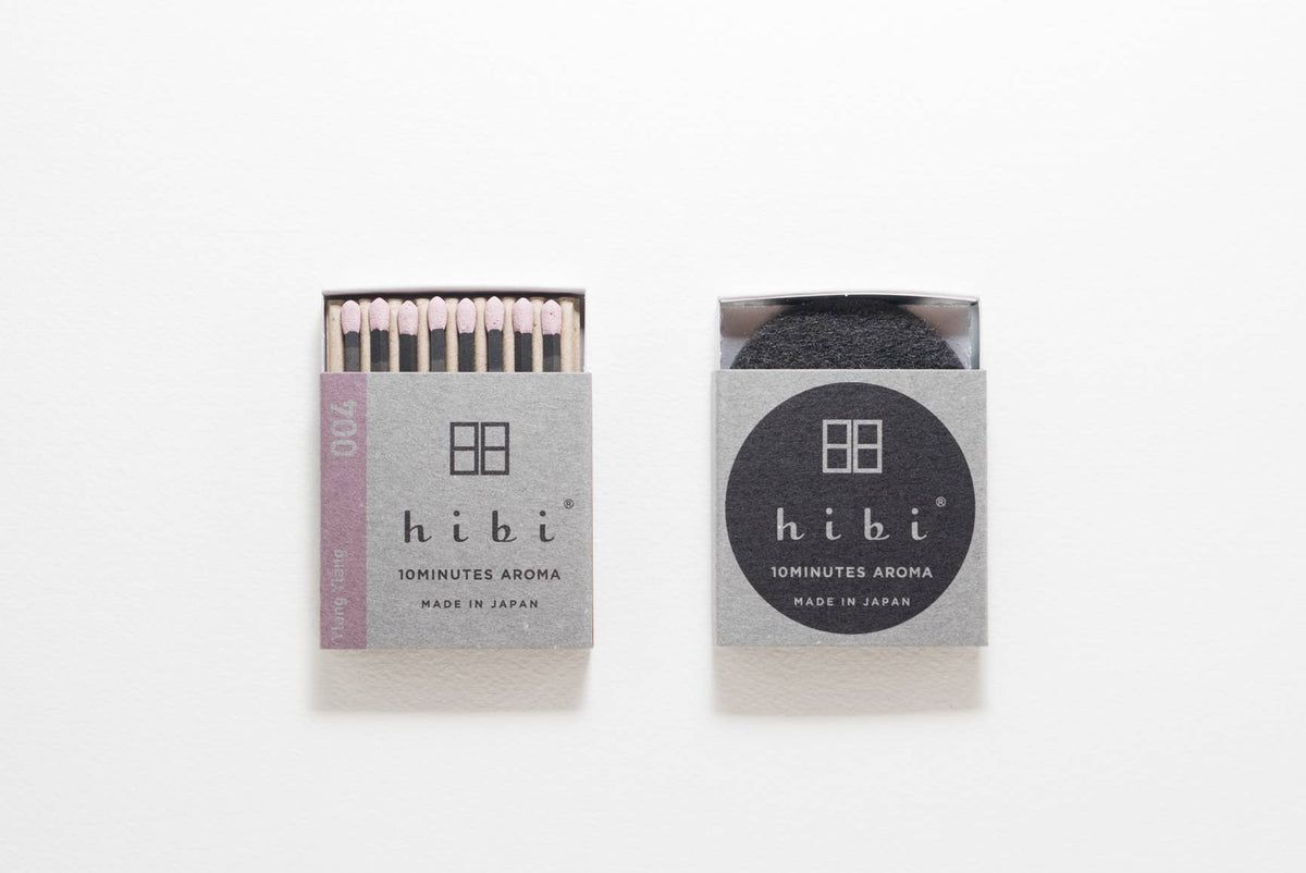 Hibi Ylang Ylang incense matches in a pale lilac box, open to show matchsticks beside a closed box - PABOOM