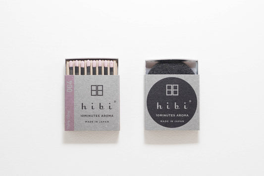 Hibi Ylang Ylang incense matches in a pale lilac box, open to show matchsticks beside a closed box - PABOOM