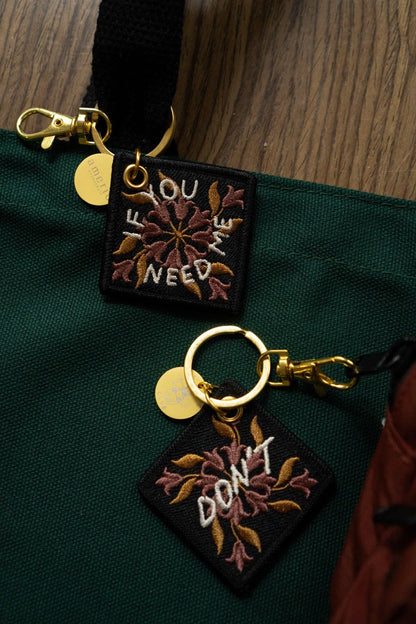 If You Need Me Keychain, close-up of embroidery detail