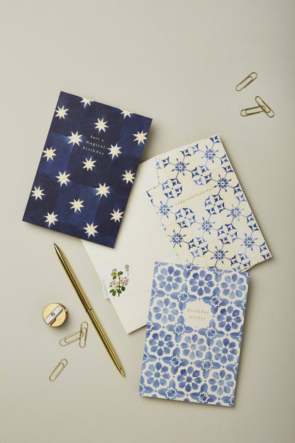 Navy Stars Magical Birthday card paired with its navy envelope