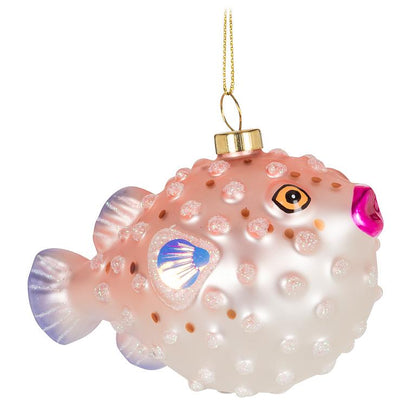 Glass puffer fish Christmas ornament in pink and white with glittery bumps, an iridescent shell-shaped eye, and a hot pink nose, hanging from a gold chain.