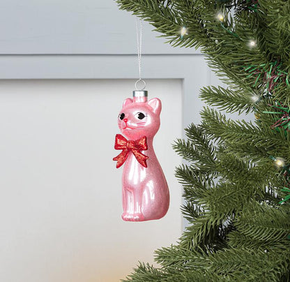 Side view of the pink glass Retro Cat Ornament showing its silhouette and shine.