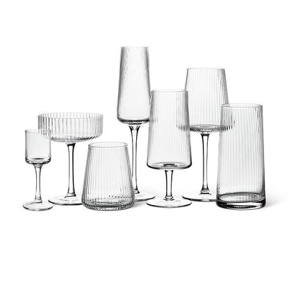 Clear glass cocktail coupe with fine optic ribbing, additional angle