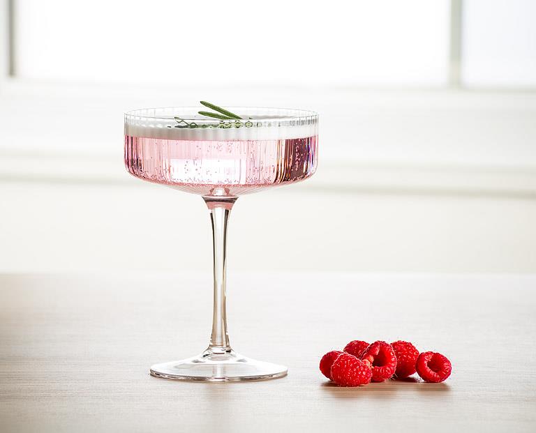 Clear glass cocktail coupe with fine optic ribbing, additional angle