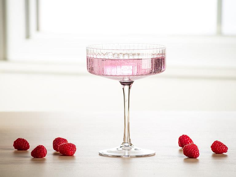 Clear glass cocktail coupe with fine optic ribbing, additional angle