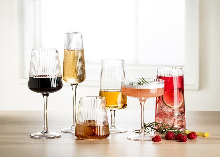 Clear glass cocktail coupe with fine optic ribbing, additional angle