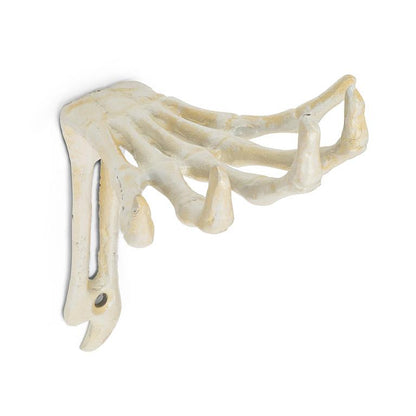Side view of the cast iron Skeleton Hand Hook showing its textured bone detail and mounting holes.