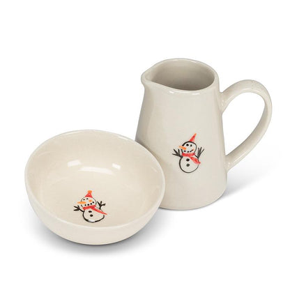 Side view of the Snowman Mini Jug showing its pouring spout and glossy glaze.