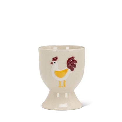 Ivory and red stoneware egg cup shaped like a rooster, 2.5 inches tall