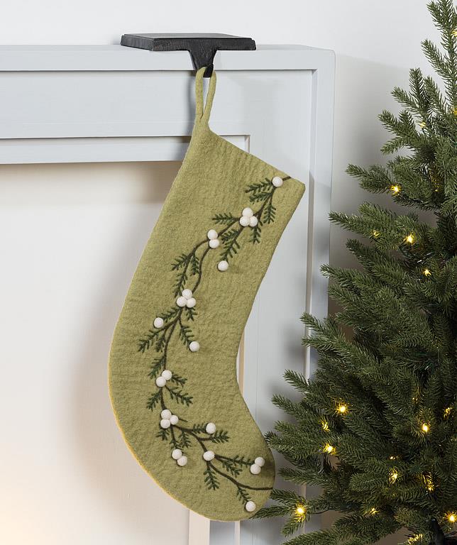Close-up detail of the mistletoe and berry embroidery on the felted stocking.