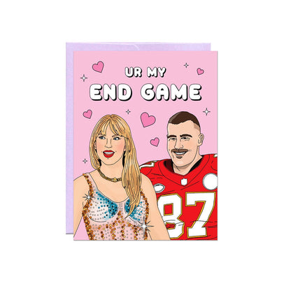 Illustrated couple card featuring a blonde woman in a sparkly sequined outfit and a football player in a red number 87 jersey, reading Ur my end game