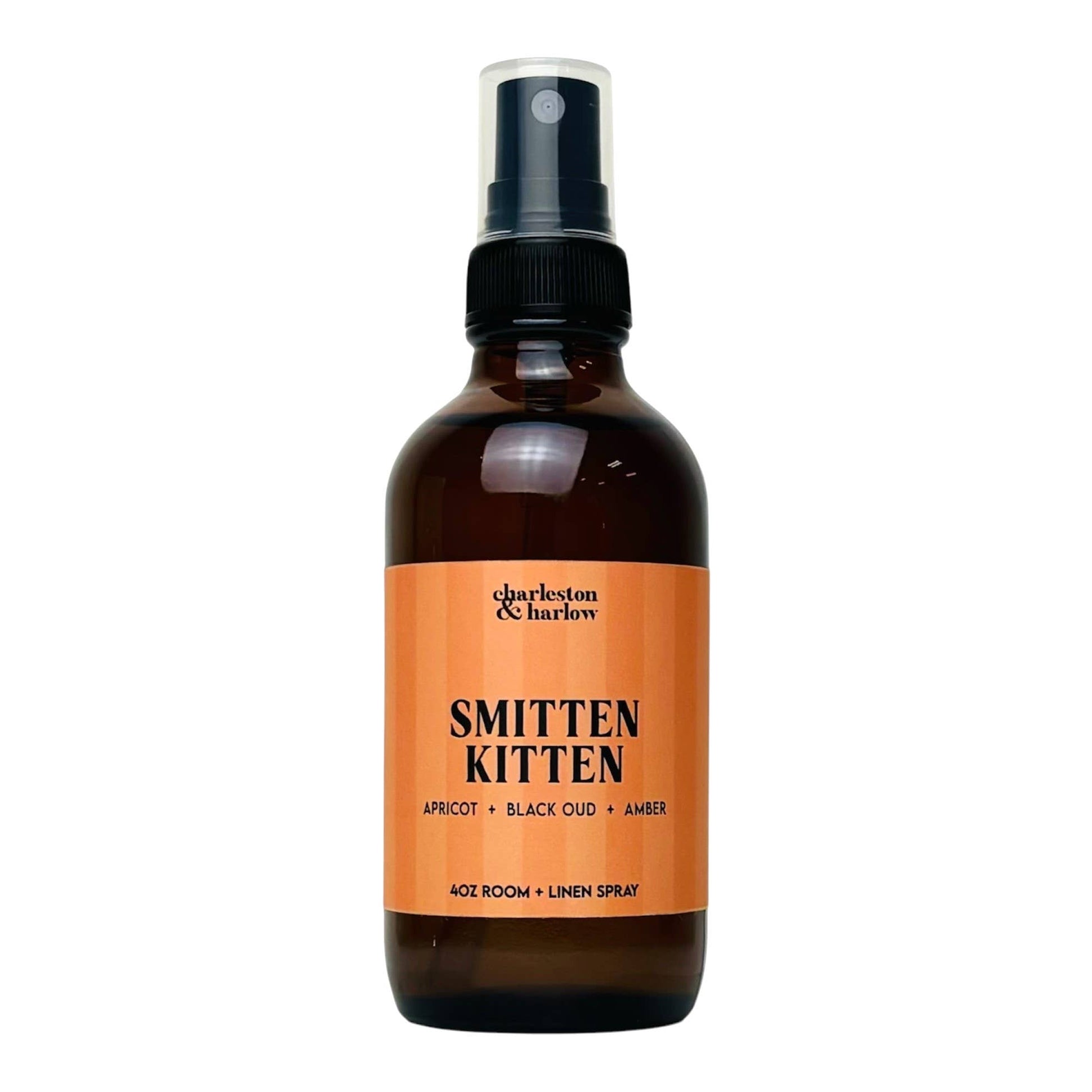Amber glass spray bottle of Charleston & Harlow Smitten Kitten room and linen spray with peach striped label
