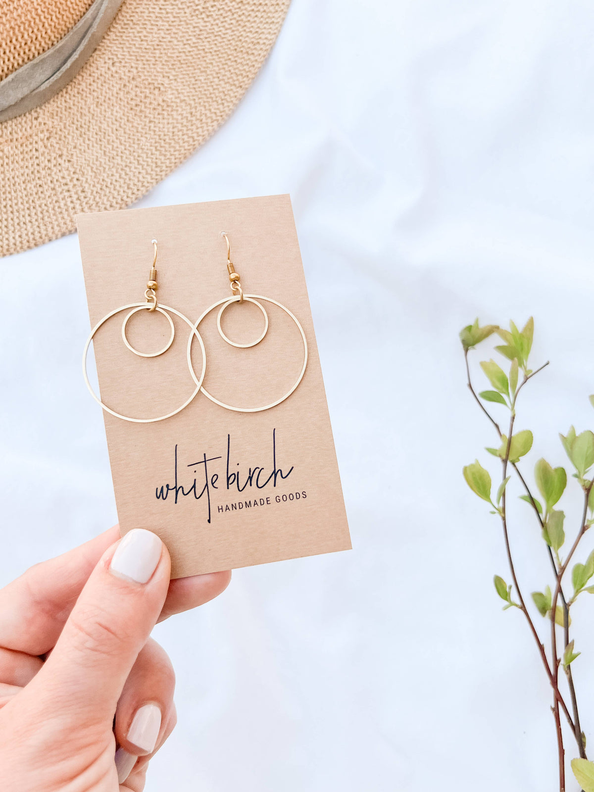 Brass double circle earrings flat lay