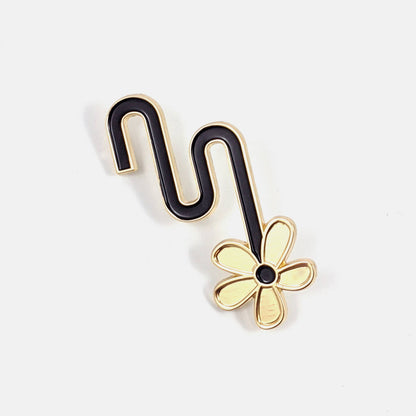 Black and gold enamel pin of a flower hanging from an S-curved stem - PABOOM