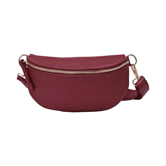Burgundy grained leather belt bag with gold hardware and an adjustable strap