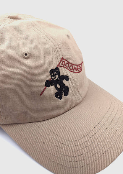 Side view of Doomed tan dad hat showing adjustable metal clasp - PABOOM