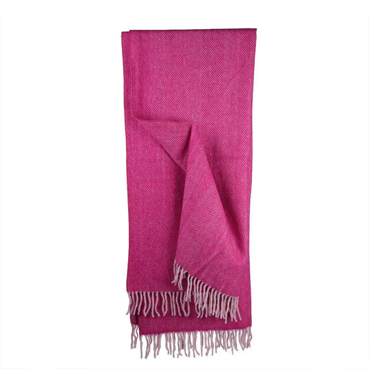 Pink herringbone wool throw blanket draped to show fringe detail - PABOOM