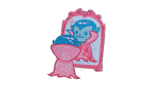 Close-up of the embroidered stitching detail on the Be Visible Trans Patch