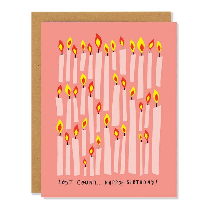 Coral birthday card filled with lit pink candles and Lost Count Happy Birthday lettering - PABOOM