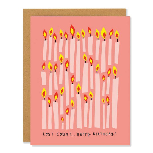 Coral birthday card filled with lit pink candles and Lost Count Happy Birthday lettering - PABOOM