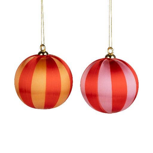 Red and orange striped yarn ball ornaments hanging by gold cord - PABOOM