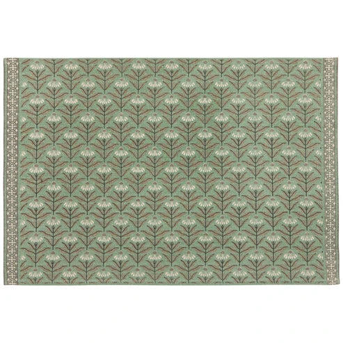 Sage green cotton rug patterned with rows of cream daisy florals and a woven border - PABOOM