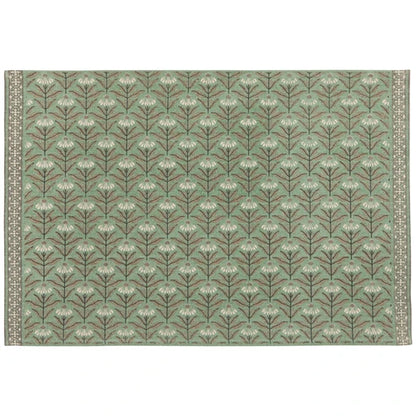 Sage green cotton rug patterned with rows of cream daisy florals and a woven border - PABOOM