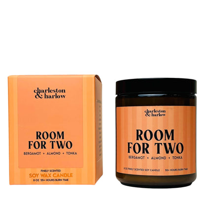 Charleston & Harlow Room For Two soy candle in amber glass jar with peach striped label, beside its matching gift box
