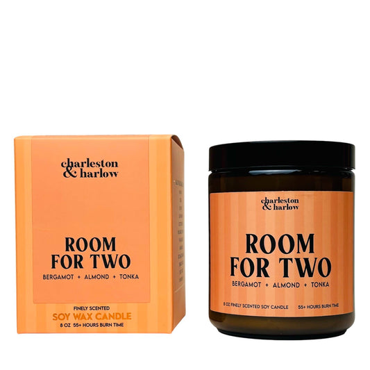 Charleston & Harlow Room For Two soy candle in amber glass jar with peach striped label, beside its matching gift box