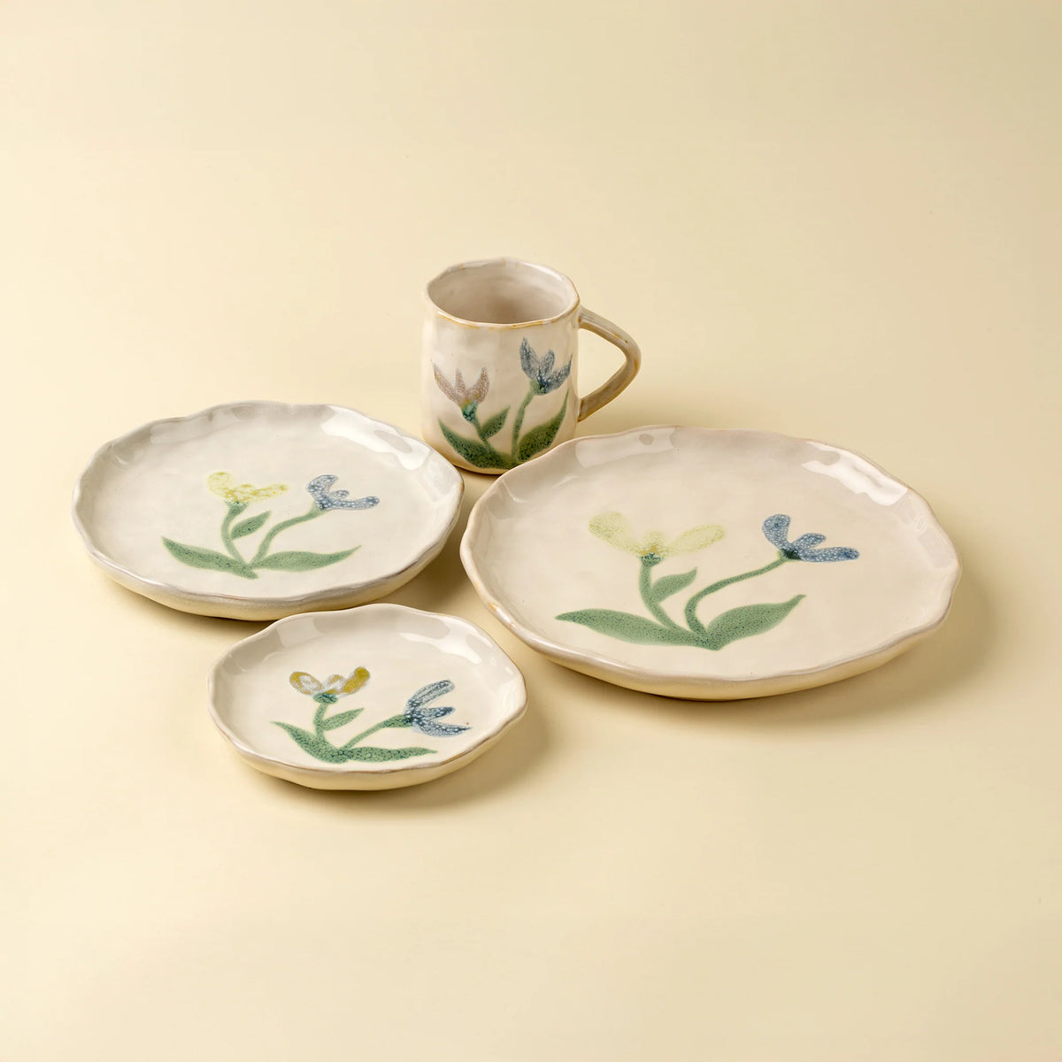 Painted Petals Plate in Iris stacked with other plates