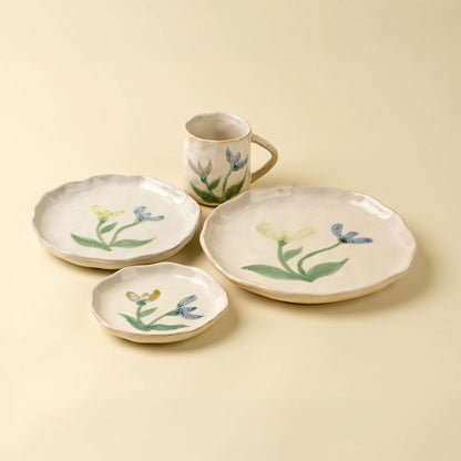 Painted Petals Plate in Iris stacked with other plates