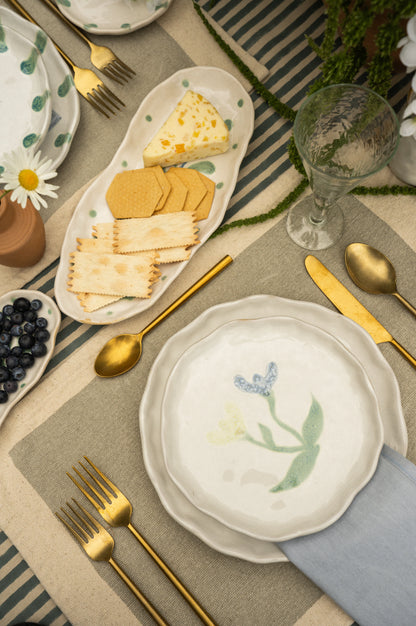 Painted Petals Plate in Iris shown at an angle