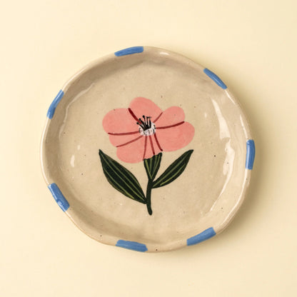 Small cream stoneware dish hand-painted with a pink and blue floral design
