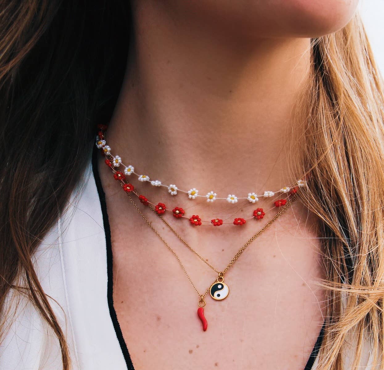 Additional angle of the handmade daisy flower beaded necklace in mixed nude tones - PABOOM