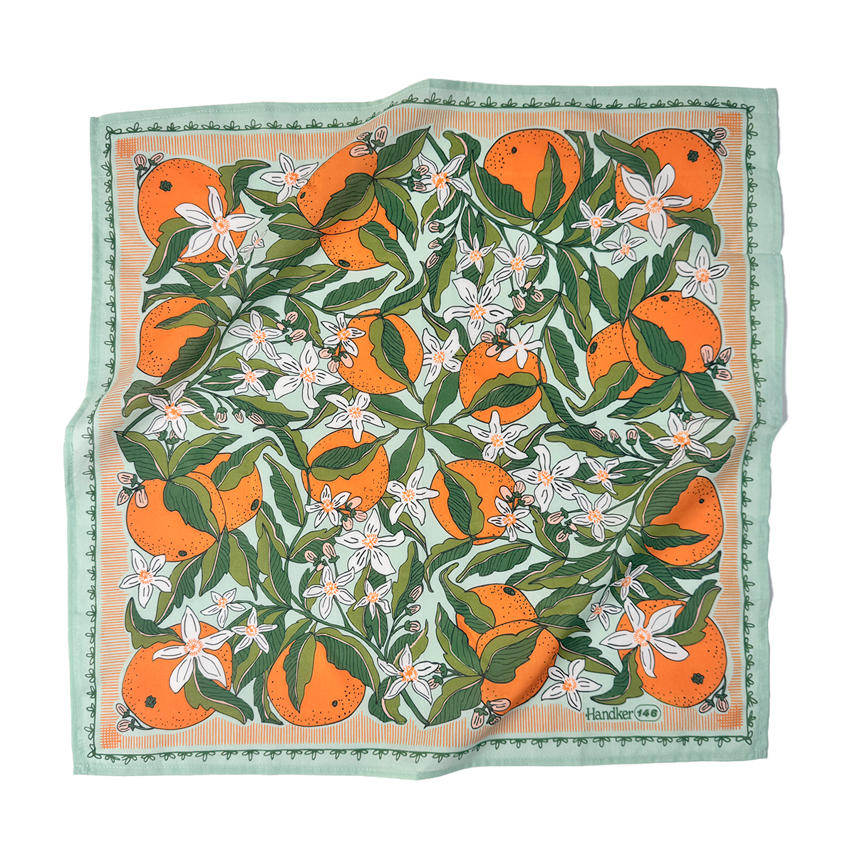 Zoe Bandana flat lay showing the citrus-orange painted print