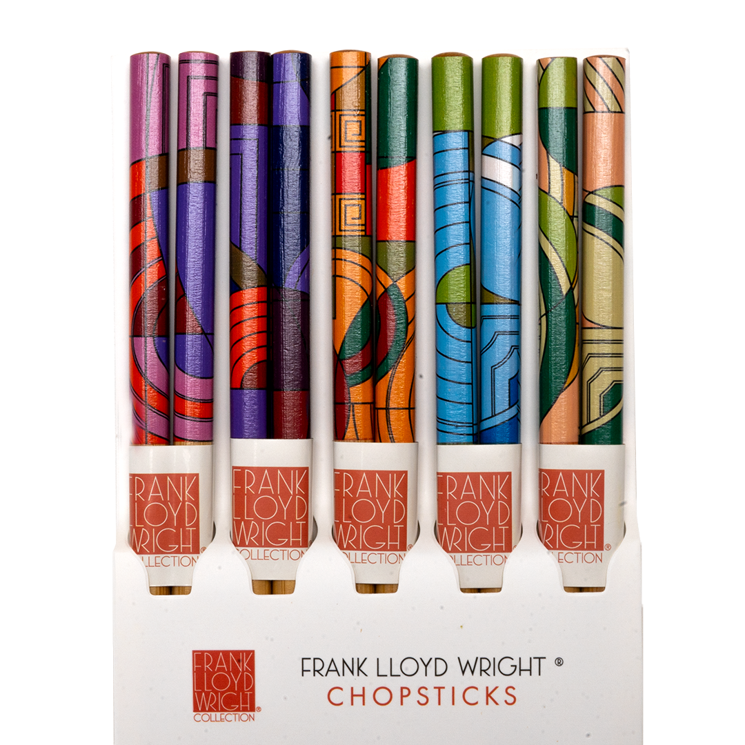 Five pairs of Frank Lloyd Wright Max Hoffman-pattern bamboo chopsticks in pink, purple, orange, blue, and green Art Deco designs, displayed upright in packaging