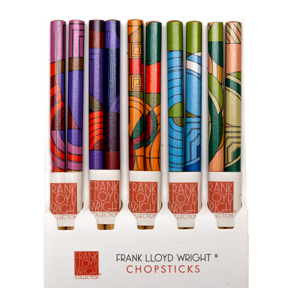 Five pairs of Frank Lloyd Wright Max Hoffman-pattern bamboo chopsticks in pink, purple, orange, blue, and green Art Deco designs, displayed upright in packaging