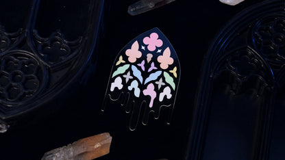 Close-up of the pastel stained-glass pattern on the Queer Gothic Cathedral Window sticker