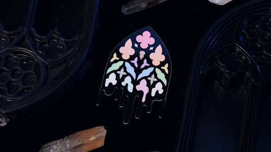 Close-up of the pastel stained-glass pattern on the Queer Gothic Cathedral Window sticker