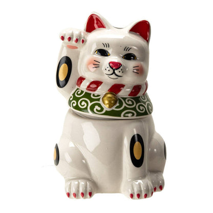 White ceramic Maneki Neko cookie jar with a raised waving paw, red ears and nose, and a green and red beaded collar with a gold bell