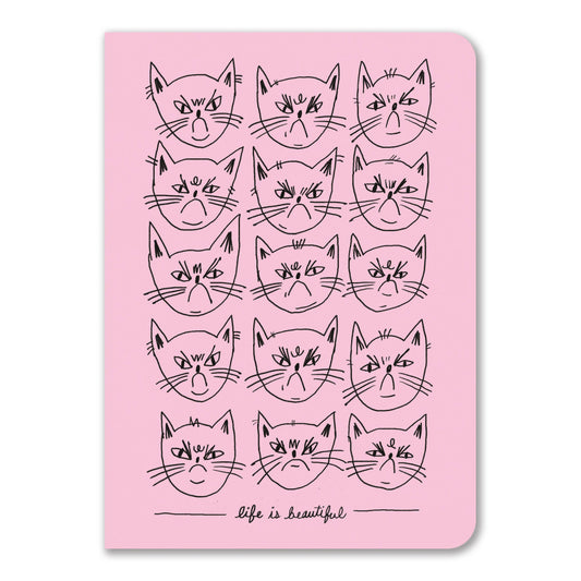 Pink notebook covered in fifteen black line-drawn grumpy cat faces with life is beautiful caption - PABOOM
