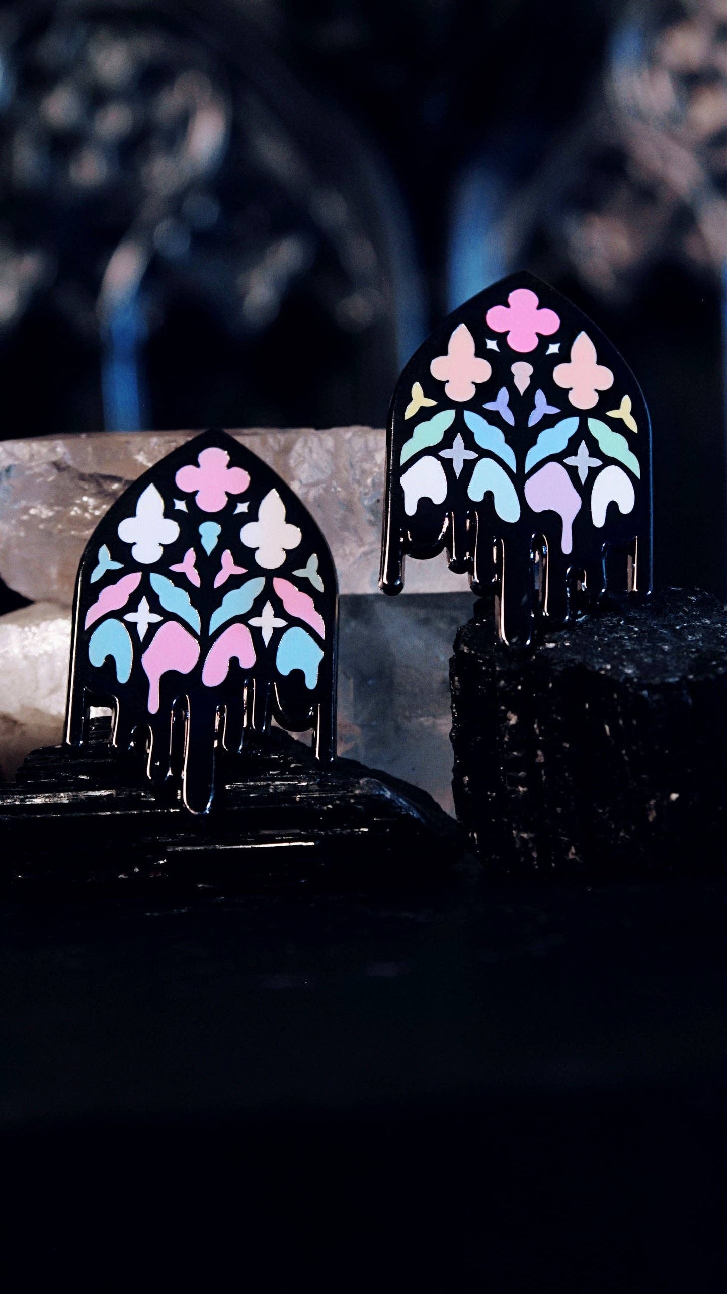 Trans Gothic Cathedral Window pin shown on a card backing for scale