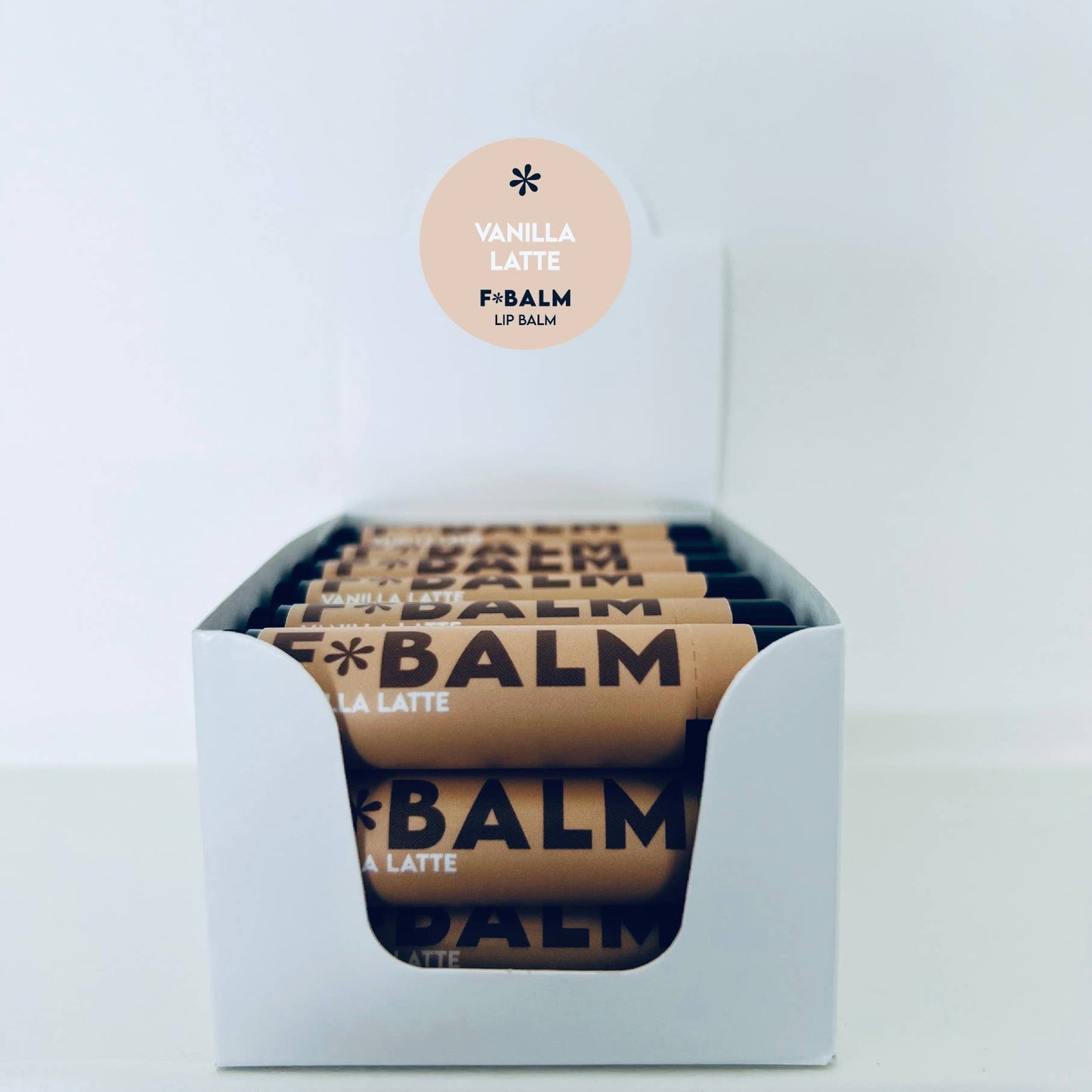Charleston & Harlow Vanilla Latte lip balm cap removed showing balm
