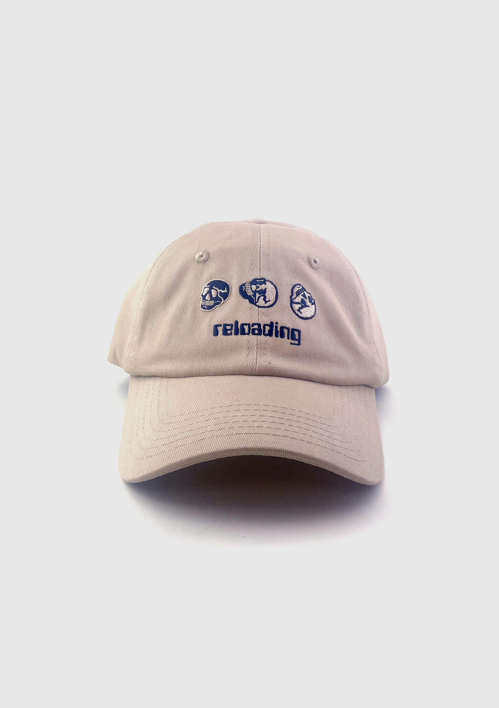Tan dad hat embroidered with three small skulls and the word reloading - PABOOM